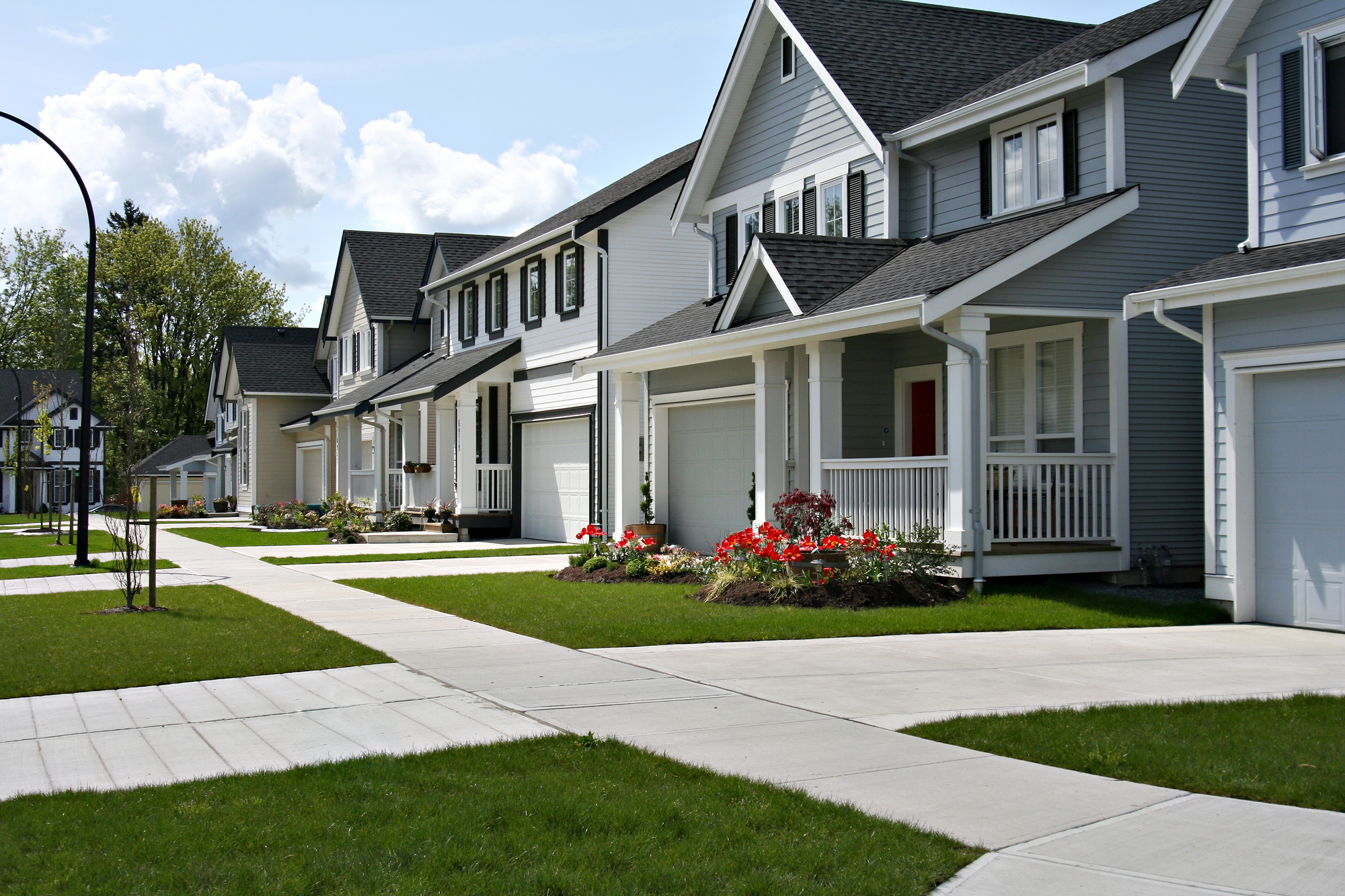 Friendly neighbourhood Small town residential street of new town homes.
